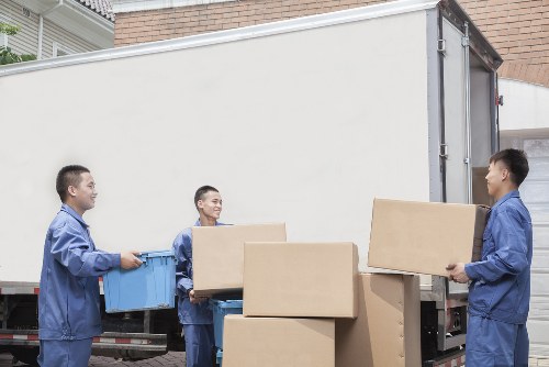 Man and van service loading boxes in Homerton street