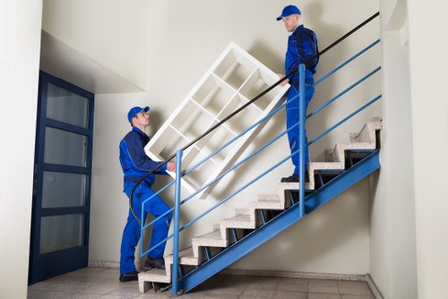 Professional removal team packing household items for storage