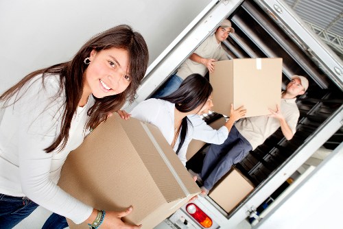 A prepared home move with labelled boxes and furniture protection